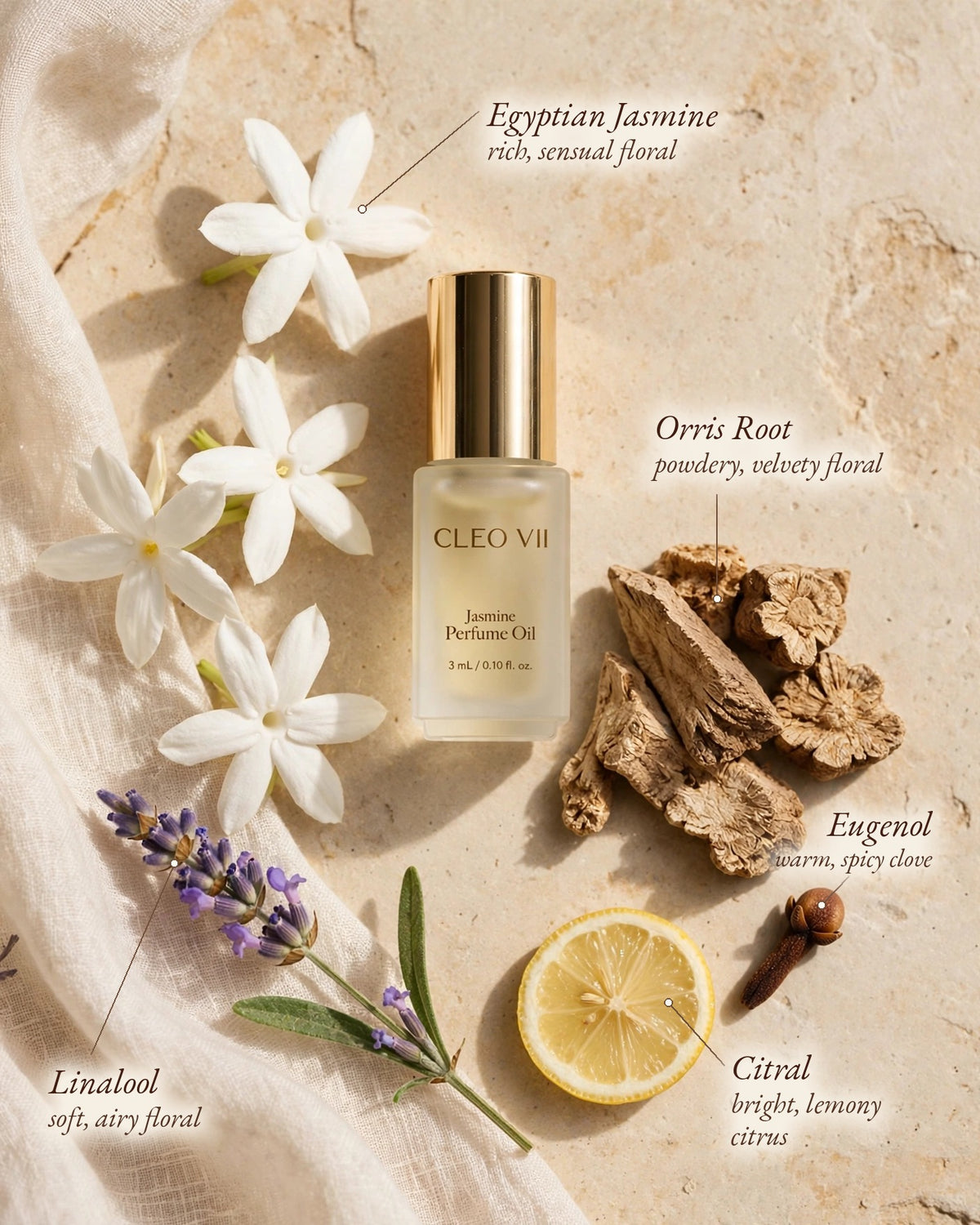A bottle of Cleo VII Jasmine Perfume Oil is styled in a flat lay with labeled botanical ingredients including white flowers, lavender, turmeric, lemon, and a nut, on a beige stone background.