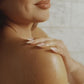 CLEO VII body oil applied to skin, absorbing with no greasy finish